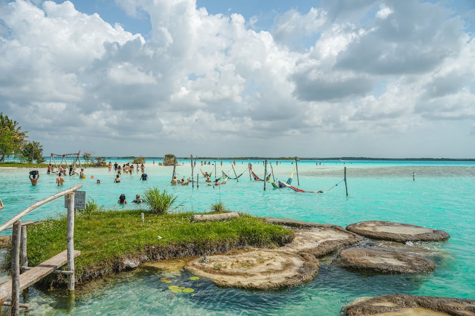 Relax by the turquoise waters of Bacalar Lagoon, a perfect tropical getaway with sandy shores and scenic views.
